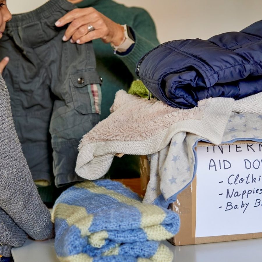 grandmother-and-grandchild-collecting-supplies-for-2024-12-02-03-42-34-utc